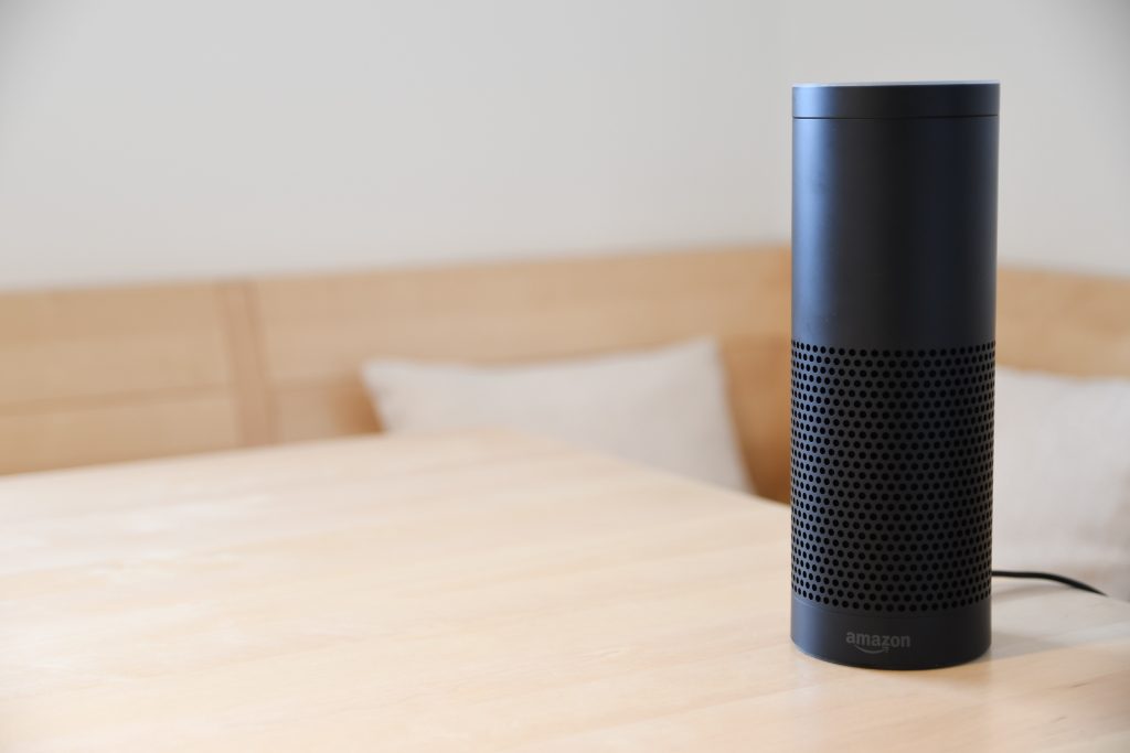 Black Amazon Echo dot on a table